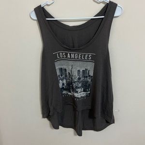 Brand unknown. Brown-ish color. Crop top like look. Loose fit.